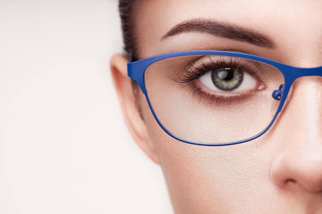 woman wearing blue eye glasses